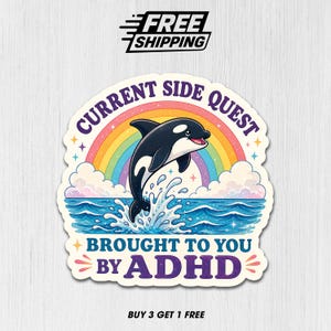 May include: A sticker featuring a cartoon orca leaping from blue water, with a rainbow and clouds in the background. Text reads "CURRENT SIDE QUEST BROUGHT TO YOU BY ADHD". The sticker has a white border and the words "FREE SHIPPING" at the top.
