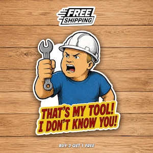 May include: A sticker featuring a cartoon construction worker with an angry expression, wearing a white hard hat and blue shirt, holding a wrench. Text on the sticker reads "THAT'S MY TOOL! I DON'T KNOW YOU!" and "FREE SHIPPING".