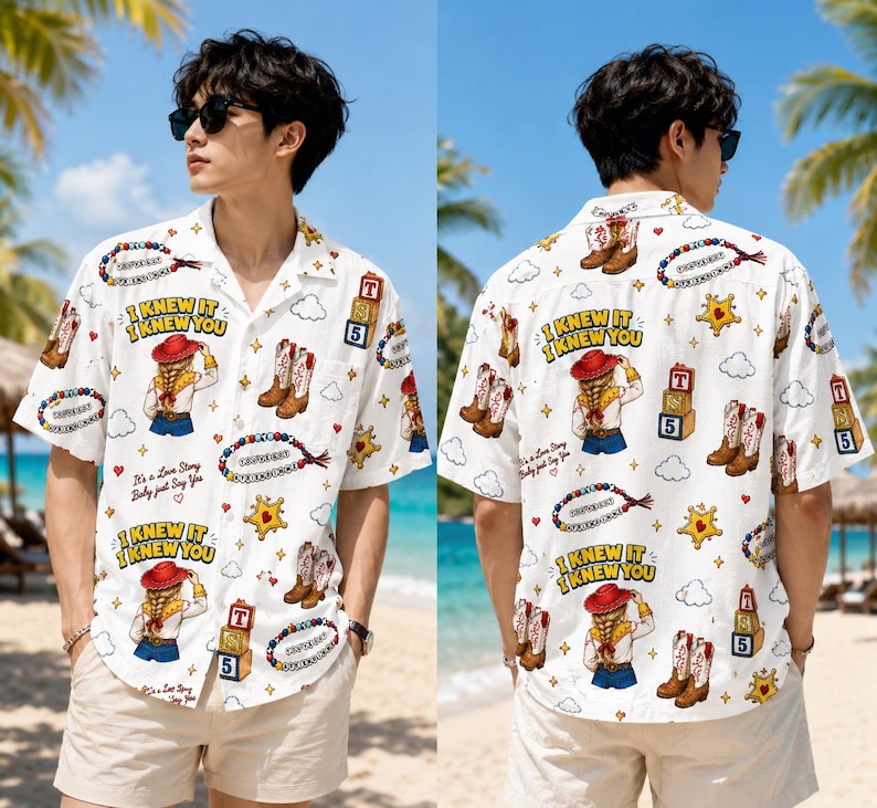 May include: A white short-sleeve button-down shirt featuring a repeating graphic print of a cowgirl, cowboy boots, star badges, alphabet blocks, and beaded necklaces. The text "I KNEW IT I KNEW YOU" and "It's a Love Story Baby just Say Yes" is printed.