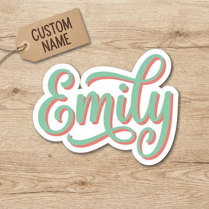 May include: A set of three ceramic mugs with a speckled, cream-colored glaze. Each mug features a different hand-painted floral design in shades of blue, green, and yellow. The mugs have a simple, rounded shape and a comfortable handle.