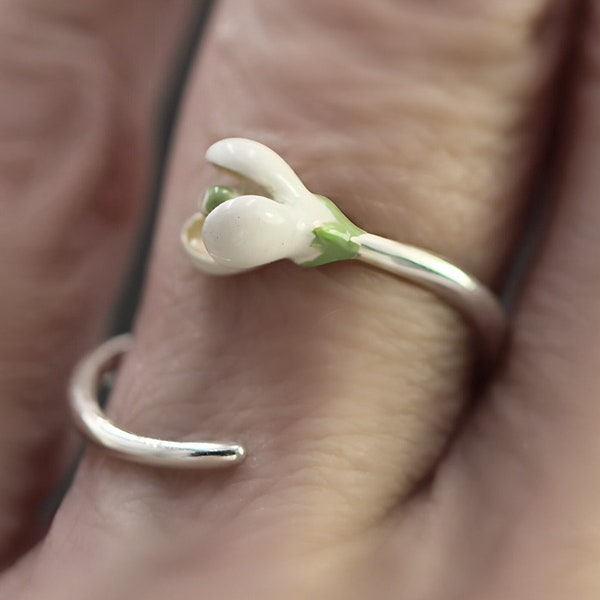 Sterling Silver Snowdrop Ring. Dainty twisted ring with white and green enamel blossom.