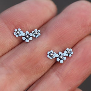 Sterling Forget me Not stud earrings. Light blue enameled dainty earrings. Partly oxidized.