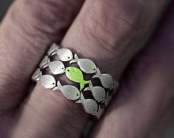 Swimming Against The Current. Sterling adjustable ring. School of fish with one green fish swimming upstream. Gifts for her.