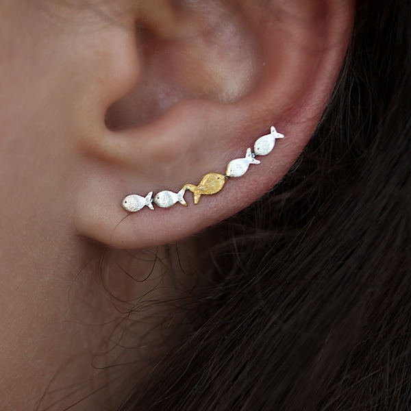 Ear climber Against The Current. Against the tide with one gold fish swimming upstream. Sterling silver fish earrings for her.