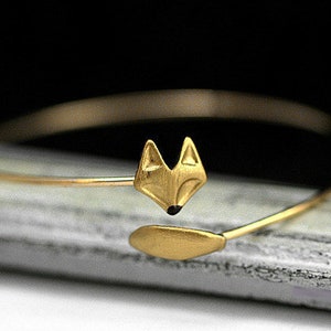 Delicate hand gilded fox bangle. Fox and tail, hand gilded and enameled. Adjustable wrap bangle.