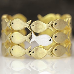 Swimming Against The Current. Sterling Gold adjustable ring. School of fish with one silver fish swimming upstream. Best gifts for her.