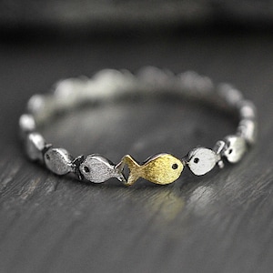Swimming against the current. Dainty sterling silver ring. School of fish with a golden one swimming upstream. Gift for her.