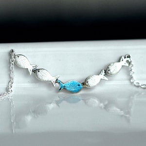 Against the current. Dainty silver necklace. Against the tide with one blue turquoise fish swimming upstream. Womens necklace. image 6