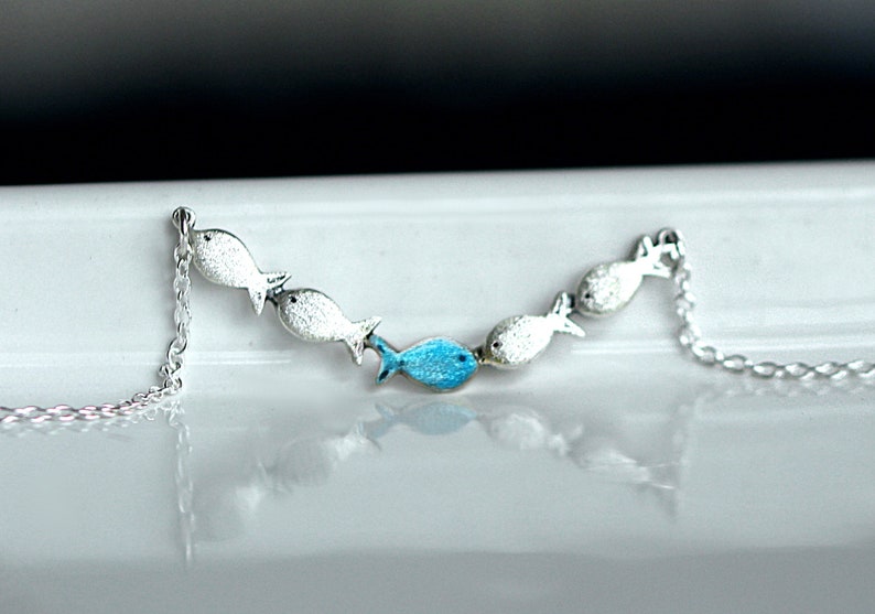 Against the current. Dainty silver necklace. Against the tide with one blue turquoise fish swimming upstream. Womens necklace. image 6