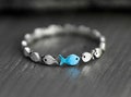 Swimming against the current. Dainty sterling silver ring. School of fish with a blue turquoise one swimming upstream. Gift for her.