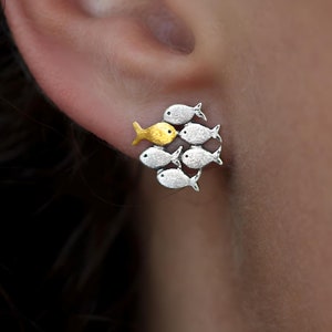 Swimming against the current. Mismatch stud earrings. School of fish with golden fish swimming upstream image 2