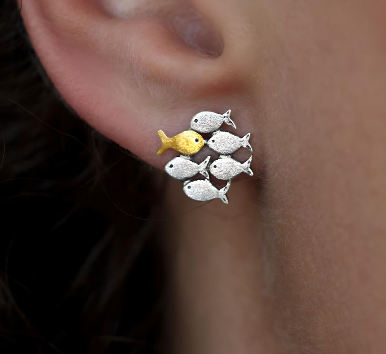 Swimming against the current. Mismatch stud earrings. School of fish with golden fish swimming upstream image 2