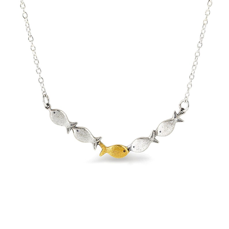 Against the current. Dainty silver necklace. Against the tide with one golden fish swimming upstream. School of fish necklace for her. image 2
