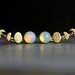 Moon Phase ear climbers. Ear crawler with glass opal. 18k gold over sterling earrings waning and waxing moon.