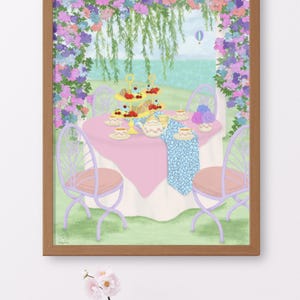May include: A framed illustration of an outdoor tea party scene featuring a round table with a pink tablecloth, a blue patterned runner, a tiered dessert stand, teacups, and a teapot, surrounded by lavender chairs under a floral archway.