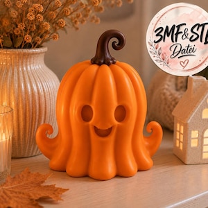 May include: A bright orange pumpkin-shaped figurine with a smiling face, round eyes, and a dark brown curly stem. A circular sticker in the upper right corner displays the text 3MF & STL Datei with a small heart icon and floral accents.