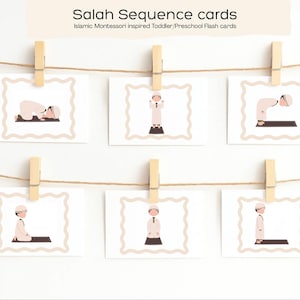 May include: Six flashcards depicting the steps of Salah, or Islamic prayer, are displayed on a string with wooden clothespins. Each card shows a different pose, with the text "Salah Sequence cards" at the top. The cards are designed for toddlers and preschoolers.