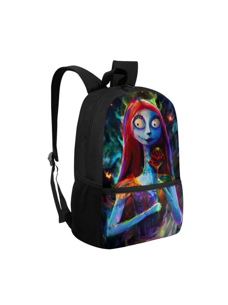 May include: A black backpack featuring a vibrant, colorful graphic print of a pale, blue-skinned character with long red hair, large eyes, and stitched facial details, holding a single red rose against a dark, swirling, multi-colored background.