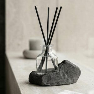 May include: A set of three ceramic mugs with a speckled, cream-colored glaze. Each mug features a different hand-painted floral design in shades of blue, green, and yellow. The mugs have a simple, rounded shape and a comfortable handle.