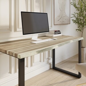 Stylish live edge desk made from rich teak wood.