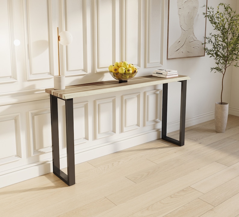 Stylish solid teak wood console with minimalist metal legs, perfect for entryways or living rooms.