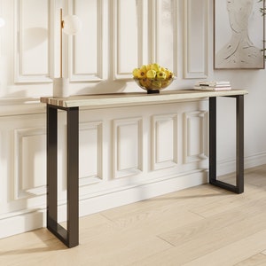 Stylish solid teak wood console with minimalist metal legs, perfect for entryways or living rooms.