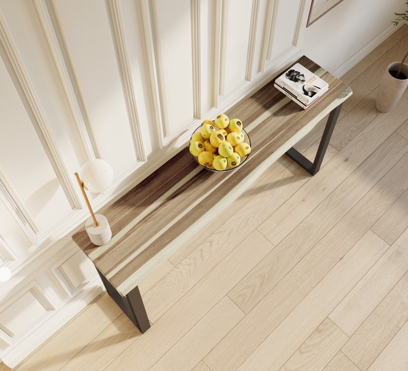 Stylish solid teak wood console with minimalist metal legs, perfect for entryways or living rooms.