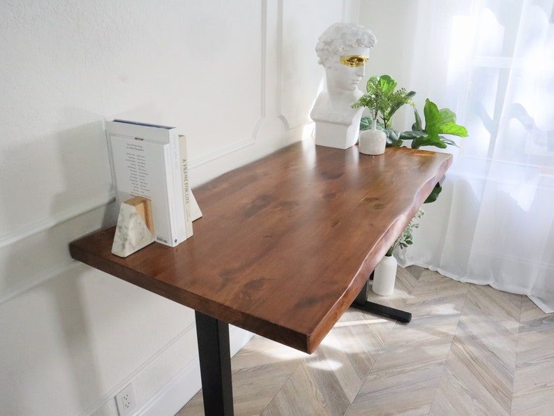 An elegant, natural wood live edge desk with unique, stand-up design, showcasing the raw, organic beauty of the wood's natural edge and texture, offering a functional and stylish workspace solution.