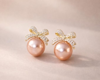 Blush Pearl Bow Earrings with Crystal-Accented Gold Setting
