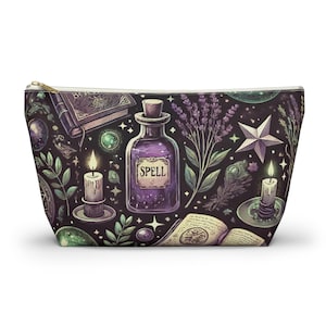 May include: A purple and green zippered pouch with a repeating pattern of a potion bottle labelled "SPELL", candles, stars, and other magical elements.