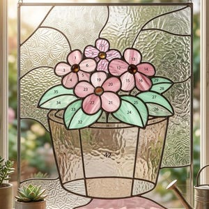 May include: A set of three ceramic mugs with a speckled, matte finish. The mugs are in shades of cream, light gray, and dark gray. Each mug has a simple, minimalist design and a rounded handle. The mugs are likely for coffee or tea.