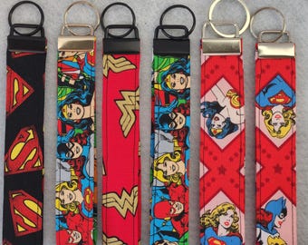 Wristlet keychain-Cartoon DC Caracter's. Wonder woman, Superman, Supergirl, Batgirl.