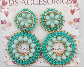 Exclusive seed-bead earrings.