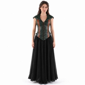 May include: A sleeveless bodice featuring a dark green textured front with brown vertical panels and a central lace-up closure, paired with a floor-length black skirt. The bodice has a wide collar and a pointed hemline, while the skirt is full.