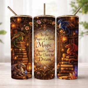 May include: A cylindrical tumbler with a straw featuring a fantasy library scene with stacks of books, glowing lanterns, and colourful dragons. The centre text reads: In the Pages of a Book, Magic Awaits Those Who Dare to Dream. The design includes floral accents.