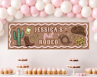 May include: A rectangular banner with a scalloped border featuring the text 'JESSICA'S first RODEO' in brown and pink. Illustrations include a green cactus, a brown cowboy boot, a lasso, a sheriff badge, a wanted poster, and horseshoes.