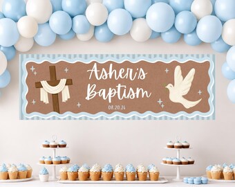 May include: A rectangular banner featuring a brown background with a light blue scalloped border, displaying a wooden cross draped in white cloth, a white dove, and the text Asher's Baptism 08.20.26, surrounded by a balloon arch of white and blue.