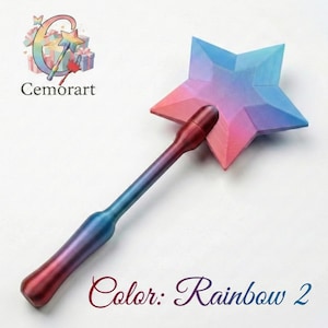 May include: A star-shaped wand in rainbow hues, with a matching handle. The wand's colour shifts from red to blue, and the star displays pink, blue, and purple shades. The text "Color: Rainbow 2" is written in a cursive font.