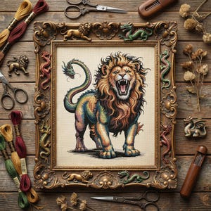May include: A framed cross-stitch of a lion with a dragon tail, in a gold ornate frame. The lion is multi-colored with an open mouth. The frame is surrounded by embroidery floss, scissors, and decorative lion and dragon figurines.