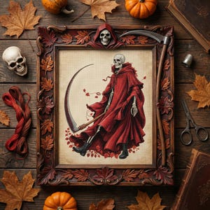 May include: A framed artwork featuring a skeleton in a red hooded cloak holding a scythe. The ornate, dark brown frame is decorated with carved leaves and a skull. The image is surrounded by autumn leaves, pumpkins, and a skull on a wooden surface.