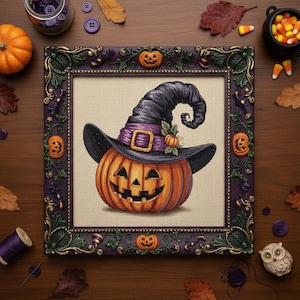 May include: A framed Halloween cross-stitch featuring an orange pumpkin wearing a black witch hat with a purple band and buckle. The frame is dark purple with gold accents and pumpkin details. The background includes fall-themed decorations.