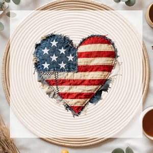 May include: A heart-shaped patch featuring the American flag design. The patch has a denim blue section with white stars and a red and white striped section. The edges are frayed, and the patch is sewn onto a woven, circular placemat.