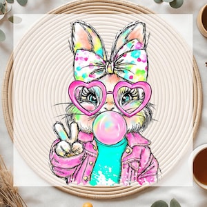 May include: A colorful illustration of a bunny wearing heart-shaped sunglasses and a pink jacket, blowing a bubblegum bubble. The bunny is giving a peace sign. The background is a woven, circular placemat.