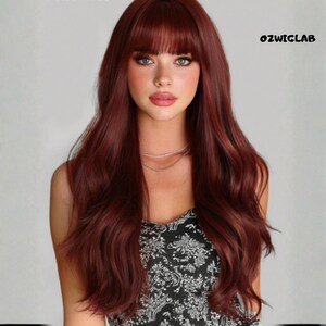 May include: A woman with long, wavy auburn hair and a full fringe. She is wearing a black and white patterned top and a delicate silver necklace. The text "OZWIGLAB" is visible in the upper right corner.