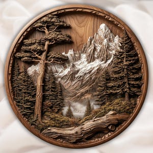 May include: A round, wooden wall art piece featuring a detailed relief carving of a mountain landscape. The artwork depicts snow-capped mountains, evergreen trees, and a large tree in the foreground, all within a circular frame. The wood has a warm, natural tone.