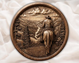 May include: A circular wooden relief carving of a cowboy on horseback in a mountainous landscape. The detailed carving shows a cowboy wearing a hat and riding a horse, with a river winding through the valley. The artwork is framed by a circular wooden border.