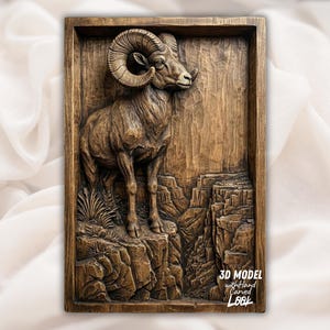 May include: A detailed, hand-carved wooden relief sculpture of a ram standing on a rocky cliff. The artwork is framed and features the text "3D MODEL with hand Carved Look". The ram has large, curved horns and is set against a textured background.