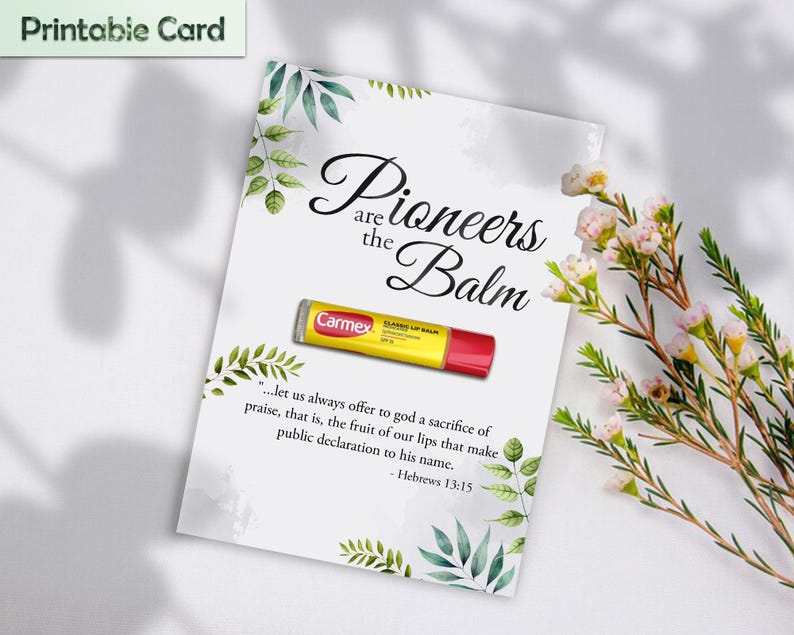 May include: A printable card with the text "Pioneers are the Balm" and a Carmex lip balm. The card is decorated with green leaves and a quote from Hebrews 13:15. The background is white with a floral arrangement.