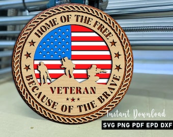 May include: A round wooden sign with the text "HOME OF THE FREE BECAUSE OF THE BRAVE VETERAN." The sign features an American flag design and silhouettes of soldiers. The words "Instant Download" and file type options are also included.
