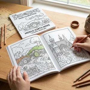 May include: A coloring book titled "The Lord of the Rings: Middle-Earth Minis" is open on a wooden table, with a person coloring a detailed illustration. Colored pencils and a map are nearby. A small backpack and wooden ring are also visible.